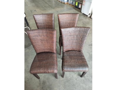 Set of four woven rattan dining chairs featuring d...