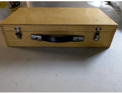 Vintage like wooden carrying case containing a com...