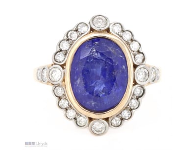 14K ROSE GOLD, TANZANITE AND DIAMOND, HALO RING.  ...