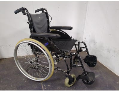 Wheelchair. The chair includes grey fabric back su...