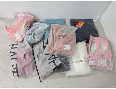 Assorted clothing includes shoes, pants and more, ...