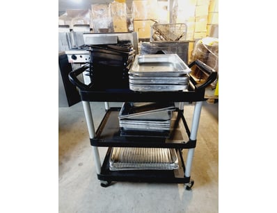 Professional three-tier utility cart featuring a r...