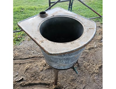 Water trough, metal construction, one leg not atta...