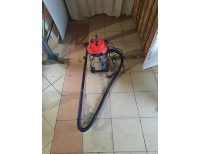 Corded vacuum cleaner, red and black and silver fi...