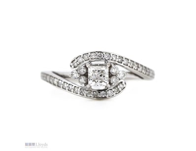 14K WHITE GOLD AND DIAMOND, DRESS RING.      

The...