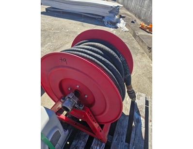 Industrial-grade hose and reel assembly featuring ...