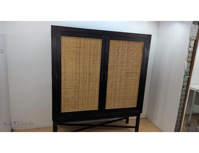Mid-century modern cabinet featuring a black-stain...