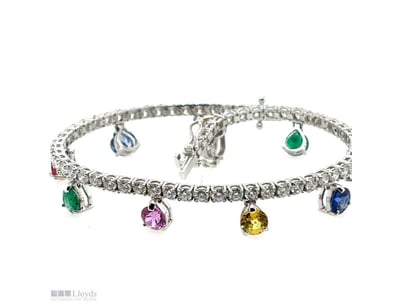 18CT WHITE GOLD DIAMOND, SAPPHIRE, RUBY, AND EMERA...