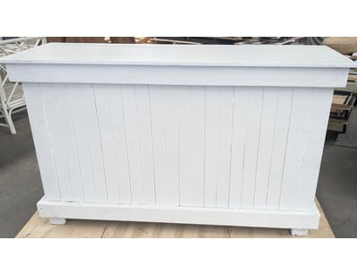 White painted timber bar counter featuring vertica...