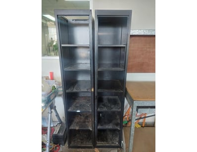Black metal storage units resemble a 6-tier slim b...