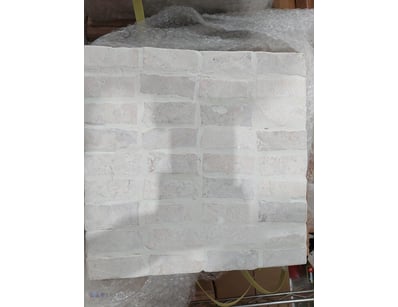 Cream-coloured brick veneer sheet featuring a trad...