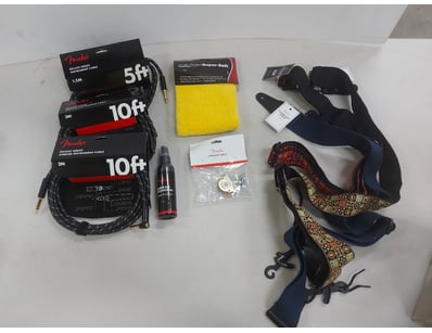 Assorted Fender guitar accessory bundle featuring ...