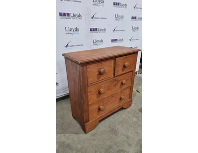 Charming timber chest of drawers featuring a tradi...