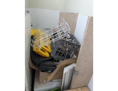 Large collection of dishwasher baskets and accesso...