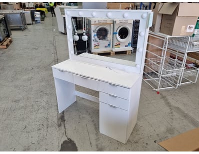 White vanity desk set featuring a large illuminate...