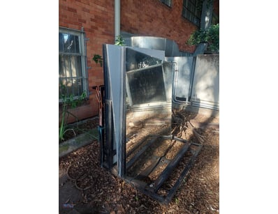 Large, frameless rectangular mirrors supported by ...