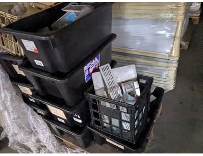 Bulk lot comprising multiple black plastic storage...