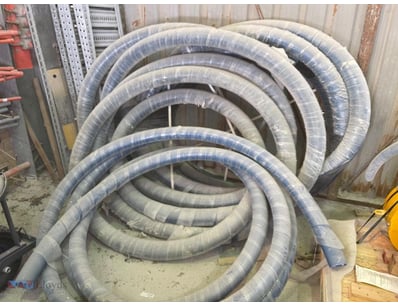 Large coil of flexible ducting/flexible hose tubin...
