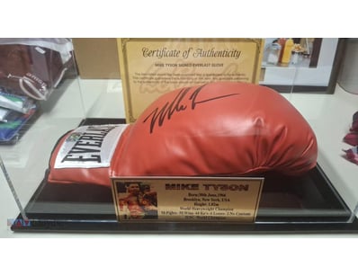 MIKE TYSON SIGNED BOXING GLOVE IN DISPLAY CASE

Mi...
