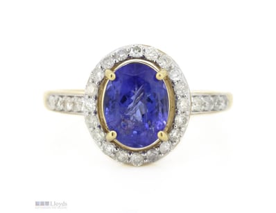 14K YELLOW GOLD, TANZANITE AND DIAMOND, HALO RING....