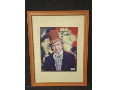 THIS IMAGE FEATURES A FRAMED PHOTOGRAPH OF GENE WI...