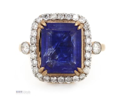 14K ROSE GOLD, TANZANITE AND DIAMOND, HALO RING.  ...