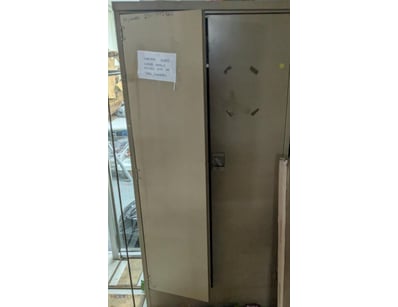 Storage cabinet with two tall doors featuring adju...