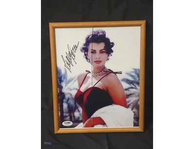 THIS IMAGE FEATURES A FRAMED, SIGNED PHOTOGRAPH OF...