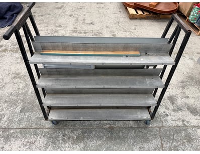 Industrial mobile shelving unit featuring a black ...