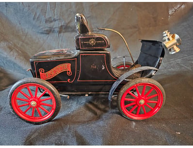AUTOMOBILE WITH HEADLAMP  DECANTER AND RED SPOKED ...