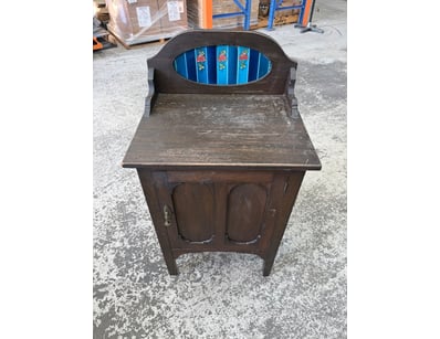 Vintage wooden bedside cabinet featuring a distinc...