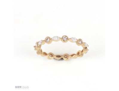 0.65 CT ROUND AND MARQUISE ETERNITY BAND IN 18KT Y...