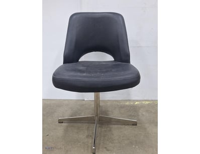 Modern black upholstered dining chair featuring a ...