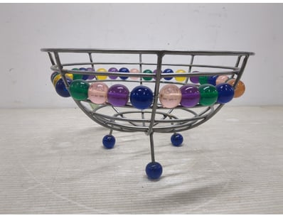 wire frame kinetic fruit bowl featuring concentric...
