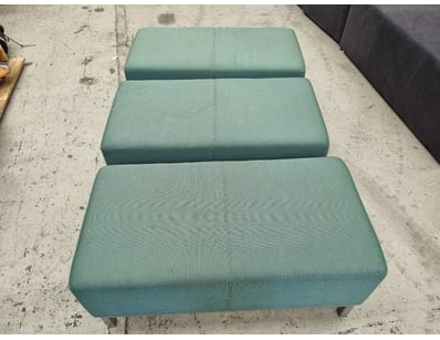 Set of three contemporary upholstered ottomans fea...