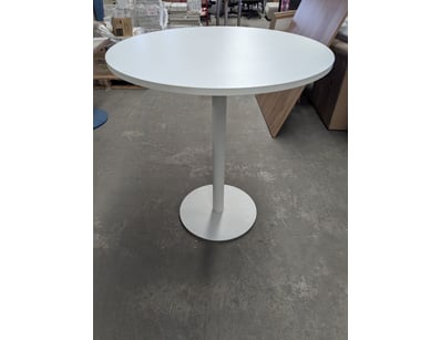 Modern  dining table featuring a clean white finis...