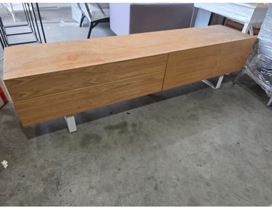 Timber TV unit featuring warm honey tones and natu...