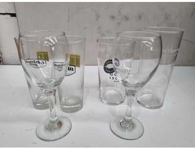 Collection of six promotional beer glasses featuri...