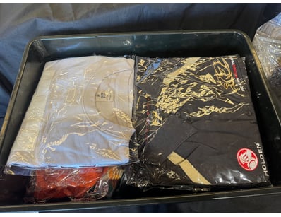 Assorted box of shirts including various sizes

