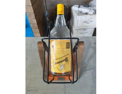 BUNDABERG RUM BOTTLE HOLDER WITH ORIGINAL BOTTLE

...