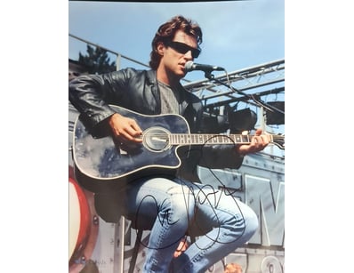 PHOTOGRAPH OF JON BON JOVI PERFORMING ON STAGE WIT...