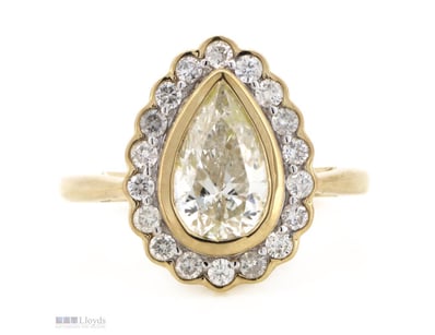 14K YELLOW GOLD AND DIAMOND, HALO RING.      

The...