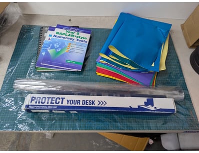 Assorted office lot, includes cutting mat, coloure...