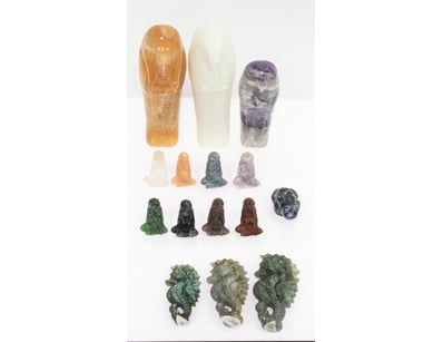 COLLECTION OF CARVED STONE FIGURINES AND VESSELS
...