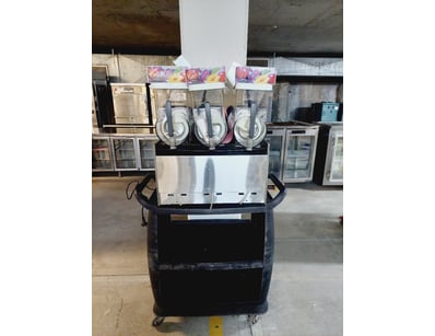 Commercial slush machine featuring three rotating ...