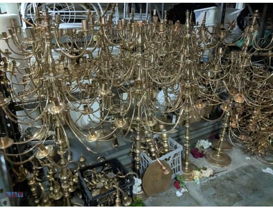 Extensive collection of brass chandeliers and cand...