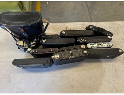 COLLECTION OF VINTAGE FOLDING CAMERA CASES AND ACC...