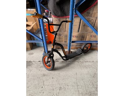 Sporter kick scooter featuring a black steel frame...