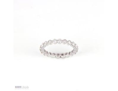 1.80 CT ROUND SHARED-PRONG ETERNITY BAND IN 18KT W...