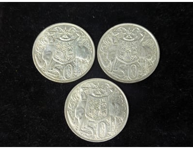 THREE SILVER 1966 ROUND FIFTY CENT COINS

Condit...